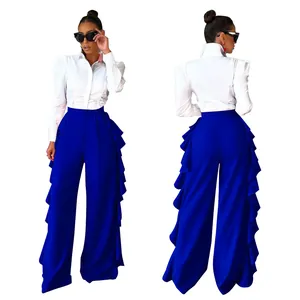 Vista frontal y trasera de la camisa blanca con mangas abullonadas y pantalones anchos azules