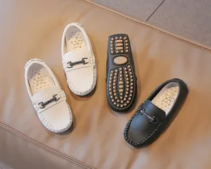 Detailed look at boys' British-style loafers with premium leather and durable soles.