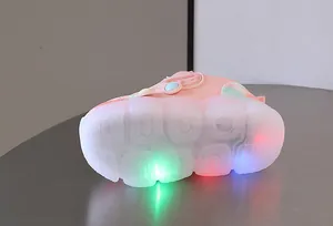 Close-up of pink toddler sneaker featuring colorful LED light-up translucent sole