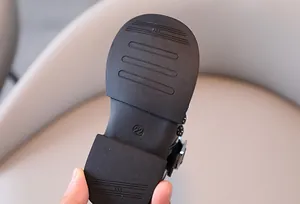 Detail view of the anti-slip rubber sole for girl's black patent leather shoes