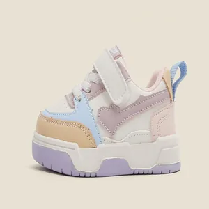 Detail showing the side profile of pastel-colored breathable children's sneakers with velcro straps