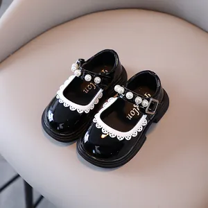 Elegant black patent leather Mary Jane shoes for girls with pearl strap and lace trim