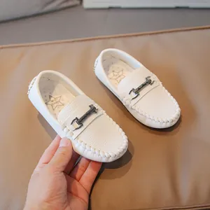 Classic white leather loafers for boys with textured grain and stylish metal buckle
