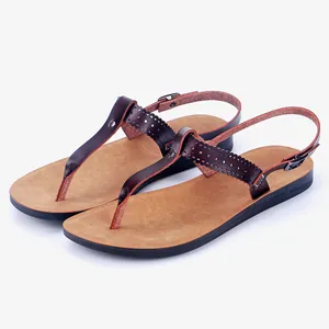Stylish brown T-strap sandals for women with laser-cut detailing and non-slip sole