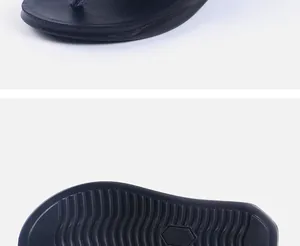 Close-up detail of anti-slip wavy sole and toe post on these black men's beach flip-flops