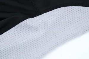 Close-up detail of the breathable mesh lining and durable flatlock stitching on sports shirt