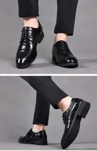 Close-up of black leather business shoes showing refined sheepskin texture and sole detail