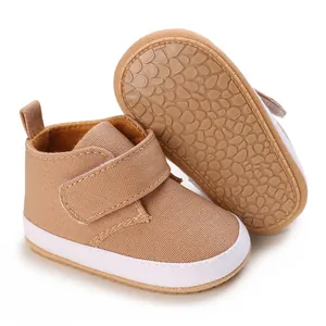 Detail view of soft-soled baby walking shoes with anti-slip rubber sole and Velcro strap.