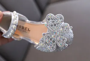 Sparkly silver girl's princess shoes with rhinestone butterfly and pearl strap details
