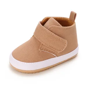Detail of khaki baby soft sole walking shoes featuring convenient hook and loop straps