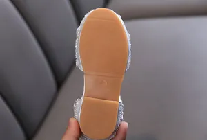 Close-up of non-slip rubber sole for girls' rhinestone princess shoes with size 26 marking