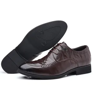 Elegant men's brown sheepskin leather dress shoes with pointed toe and textured finish