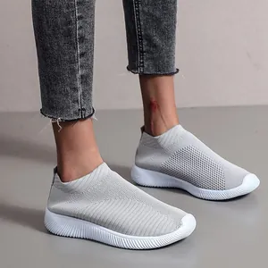 Breathable light gray knit slip-on sneakers with white rubber sole for women