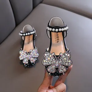 Elegant black girls' princess shoes with sparkling rhinestone butterfly and pearl strap