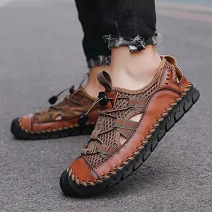 Breathable brown leather and mesh closed-toe men's outdoor sandals shown on pavement