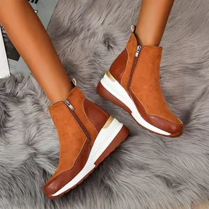 Stylish brown suede wedge ankle boots with side zipper and croc-embossed detail