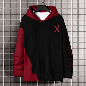 Detail view of a black and red color-block men's hoodie featuring 'X' print and sleeve embroidery