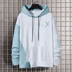 Macro view of the letter print on a color-block hooded sweatshirt