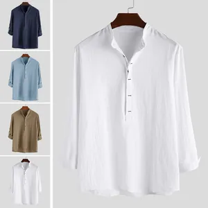 Detailed view of men's casual stand-up collar shirts showing various colors and fabric texture