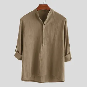 Detailed front view of khaki long sleeve shirt with mandarin collar and textured cotton fabric