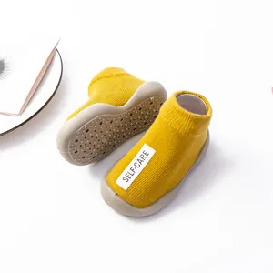 Soft sole baby walking sock shoes with breathable yellow knit and anti-slip rubber bottom