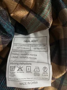 Detailed close-up of the wash tag and care instructions for a men's casual jacket