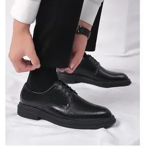 Close-up of men's black formal leather shoes with hidden height increasing sole