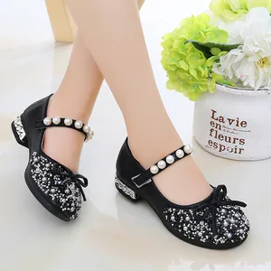 Elegant black girls' princess shoes with sparkling rhinestones, pearls, and a cute bow.