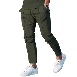 Slim fit olive green men's jogger pants with seam detail and drawstring waist style