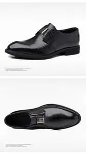 Detailansicht schwarzer Business-Schuhe aus Leder mit Krokodilprägung und H-Schnalle