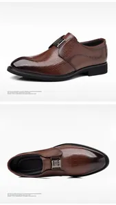 Makro-Detail von braunen Business-Schuhen aus Leder mit Krokodil-Prägung für Herren