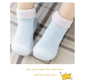 Detail of soft fleece lining and rubber sole on baby walker shoes and socks