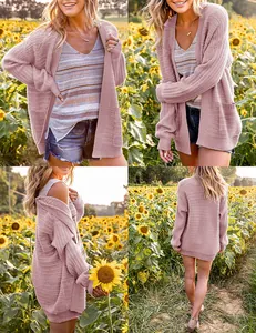 Detail view of a mauve lantern sleeve knitted cardigan in a sunflower field.