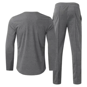 Back view of a dark grey men's long sleeve T-shirt and matching slim fit trousers set