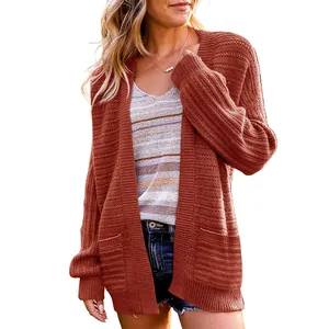 Stylish rust-colored lantern sleeve knit cardigan with an open front and pockets