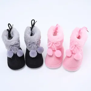 Weiche Baby-Winterstiefel mit Kunstpelzbesatz und Pompons in Rosa und Schwarz