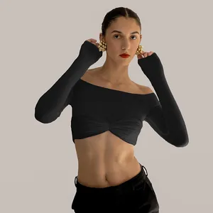 Elegant black off-the-shoulder long sleeve crop top with twist front design detail