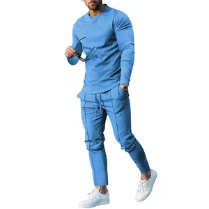 Men's light blue solid color long sleeve T-shirt and slim fit pants set shown on a model