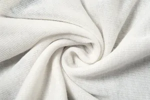 Macro view showing the soft white knitted fabric texture of the slim fit T-shirt