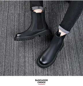 Detailed top-down view of men's premium black leather Chelsea boots with durable thick lug soles