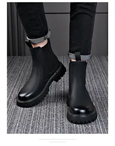 Close-up of men's black leather Chelsea boots with thick lugged EVA foam soles