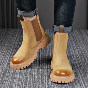Stylish men's yellow genuine leather Chelsea boots with thick lug soles for winter.