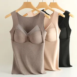 Three seamless thermal camisoles with built-in pads in grey, nude, and black colors.