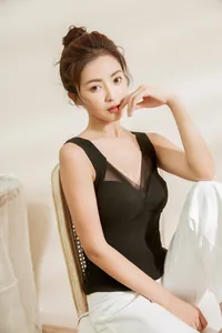 Black thermal padded camisole for women featuring an elegant V-neck mesh detail