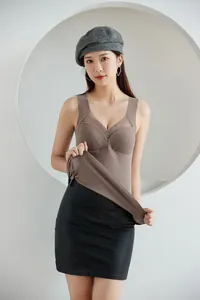 Model wearing a brown thermal tank top with built-in chest pads and mesh neck detail