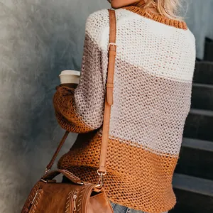 Back view of a striped color-block chunky knit sweater for women, fall winter style