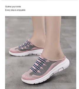 Close-up of pink fly-knit mesh mules featuring a breathable design and white comfort soles