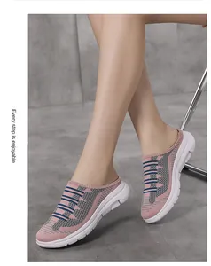 Close-up detail of breathable pink and grey knit slip-on mules for women worn by model