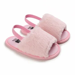 Detailed view of pink furry baby sandals featuring a soft elastic heel strap for infants