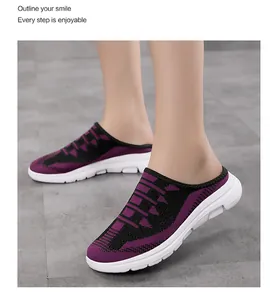 Close-up view of purple fly-knit breathable slip-on mules for women worn by a model